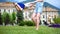 Two happy little sisters girls playing fun on green grass in summer.