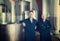 Two happy men in uniforms standing in winery fermentation compartment