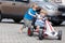 Two happy sibling boys having fun with toy car