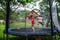 Two happy sisters on trampoline