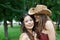 Two happy young girls in summer park