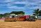 Two harvester unloading corn on tractor