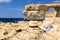 Two hats at Azure Window on Gozo island, vacation