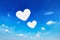 two heart shaped clouds on blue sky for valentine pattern and ba