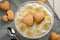 Two heart-shaped cookies on top of banana cream dessert