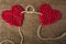 Two Hearts on burlap Background. Wedding Love Concept