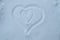 Two hearts drawn on snow, symbol of pregnancy, love