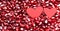 Two hearts on pomegranate berries. Berry background