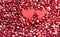 Two hearts on pomegranate berries. Berry background