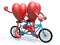 Two hearts riding tandem bicycle