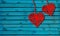 Two Hearts On Rustic Wood Blue Background. Heart Shape made By red thread hang with ropes in wooden wall, Original Love Concept
