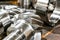 Two helical gears lie on the beams after being processed by CNC, close-up