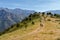 Two hikers and dog on trail near Novella in Balagne region of Co