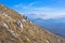 Two hikers on trekking through mountain Rtanj on a sunny day