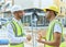 Two hispanic men architects smiling confident speaking at street