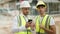 Two hispanic men architects using smartphone speaking at street