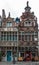 Two historic buildings holding shops in Ghent, Belgium.