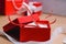 Two homemade paper red hearts in a red gift box, Symbol of Valentine`s Day