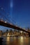 Two huge blue lights over Brooklyn bridge