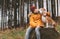 Two huging best friends portrait - boy and his beagle dog sit on