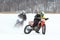 Two ice bikers racing mid winter