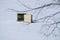 Two Ice Fishing Shacks on a Snow Covered Lake in New England