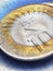 Two Indian coins lie on a textured surface. 10 rupee coin with the sign of national currency close-up. Spectacular vertical