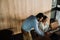 Two indian coworkers using laptop while working together in conference room