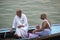 Two Indian men on boat at funeral