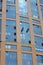 Two industrial climbers wash windows in a tall building