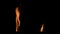 Two isolated fire flames, slow motion gas ignition from bottom to top, high speed flamethrower on black background. The