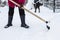 Two janitors cleans a path from the snow with a shovel