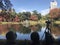 Two Japanese ladies were sitting and taking picture of wonderful red maple