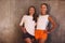 Two joyful lovely happy women of different ages having fun together on yoga training, broadly smiling on camera during workout