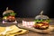 Two juicy black hamburgers on dark wooden background