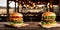 Two juicy cheeseburgers close-up on a wooden table on a kitchen board against a background of a blurred rustic