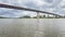 two kayakers approaching a bridge over the Missouri River