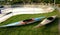 Two kayaks on grass