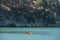 Two kayaks on the lake near the rocky shoreline. Turquoise water. Water Reservoir in Spain.