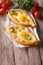 Two khachapuri and fresh vegetables close-up on the table. verti