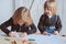 Two kid brothers drawing together at home. Happy siblings spending time together