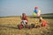 Two Kids having fun in field against blue sky background. Eco resort activities. Children farmer concept. Two little