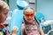 Two kids having fun and wearing medical eyeglasses during visit to dentist office