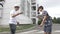 Two kids having a kendama contest in the schoolyard -