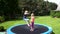 Two kids jumping on trampoline