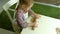 Two kids kneading the dough for make cookies together