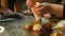 Two kids kneading the dough for make cookies together