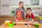 Two kids kneading the dough for making the pizza