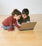 Two kids with laptop computer