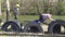 Two kids playing together, jumping and climbing on tires